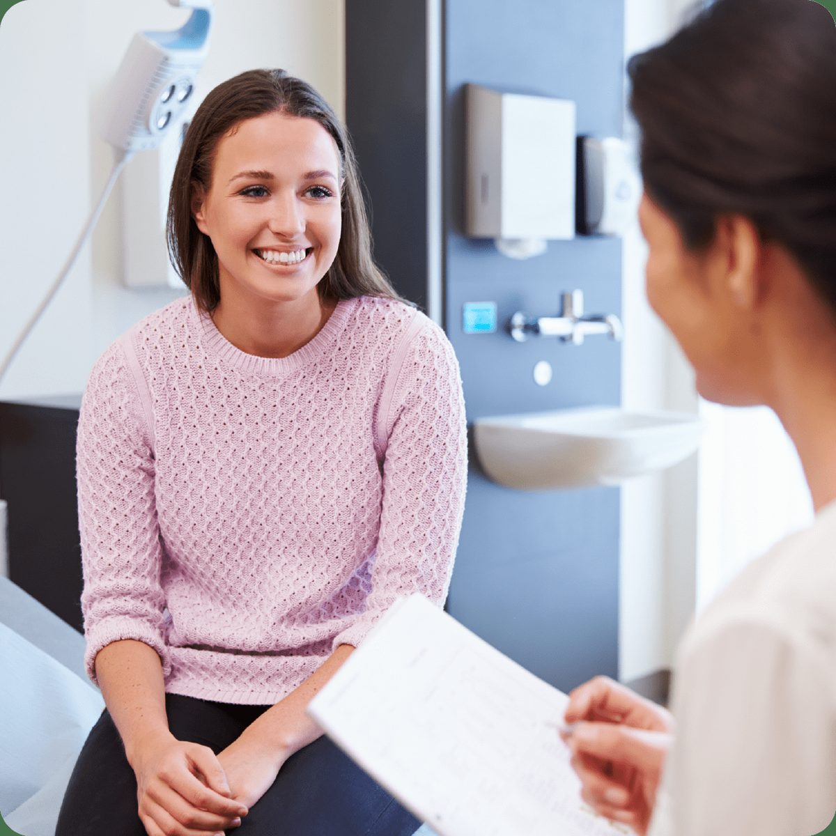 A patient talking with a team member at Parkway Periodontics
