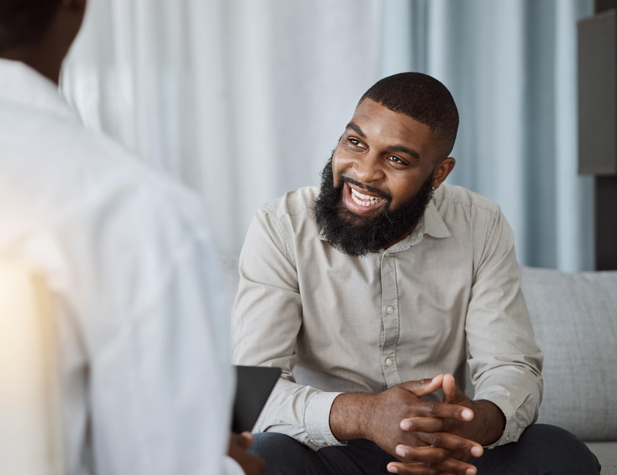 A smiling patient during a consultation